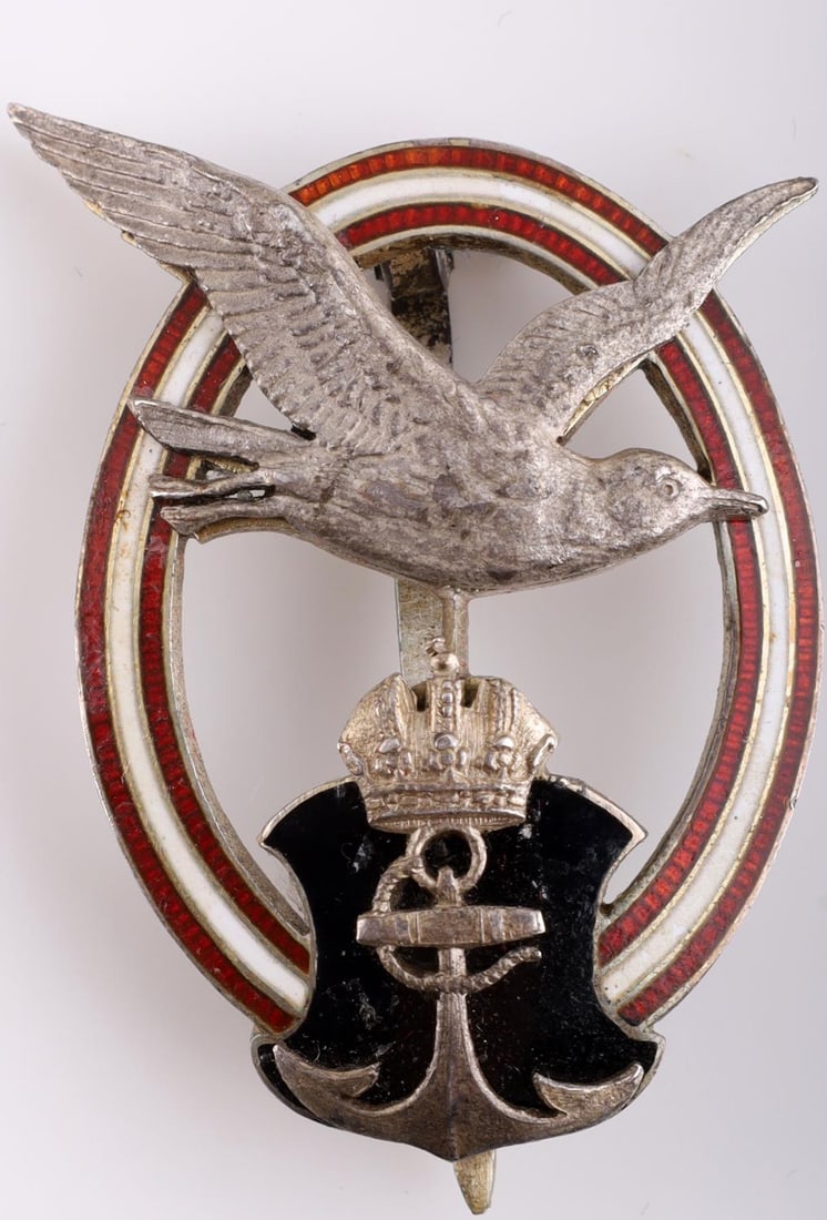 WWI IMPERIAL GERMAN AUSTRIAN NAVY PILOT'S BADGE: Standard badge with eagle in the center and oak leaf wreath. Measures 2 5/8 inches. Pin is marked George. Very good condition.