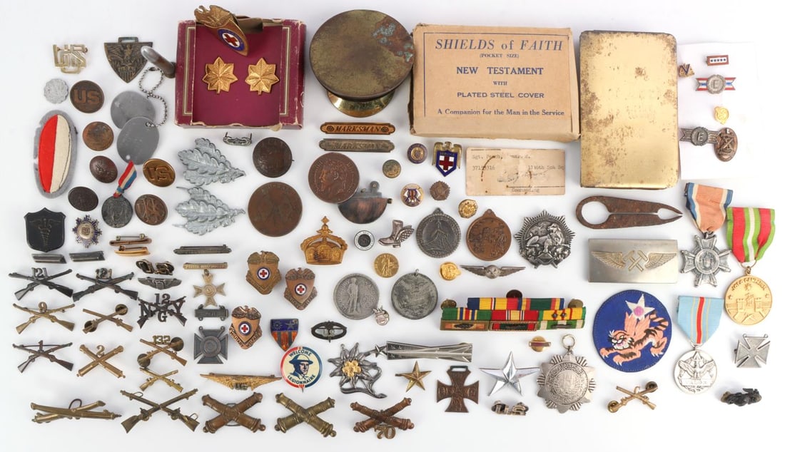 70+ WWII - PRESENT UNITED STATES MILITARY PINS: Assorted United States Military WWII era pins and badges. Two sterling wings, red cross badges, ega, and other various pins. All in very good condition.