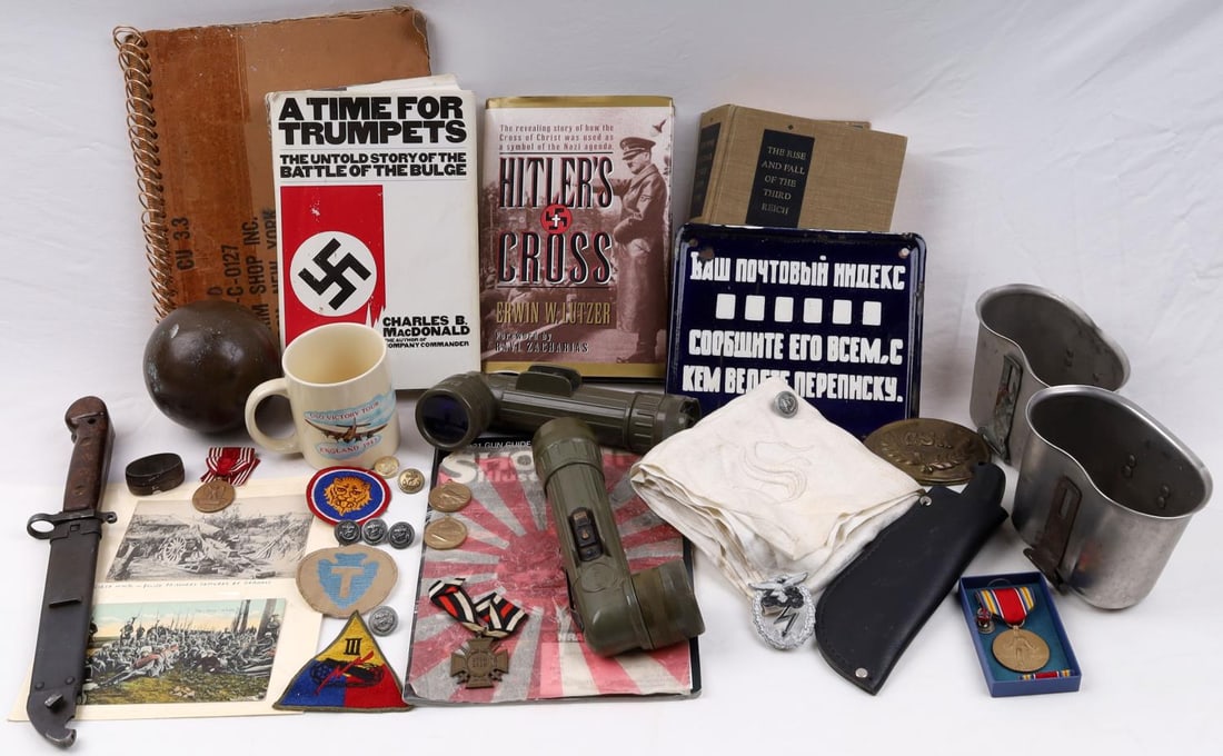 WWI WWII CIVIL WAR VIETNAM MILITARY COLLECTABLES: Large lot to include Cannon Ball with sticker stating confederate weight 5 pounds, Vietnam Photograph album, Third Reich books, Russian porcelain sign, WWI postcards, AK 47 bayonet, WWII Kriegsmarine 