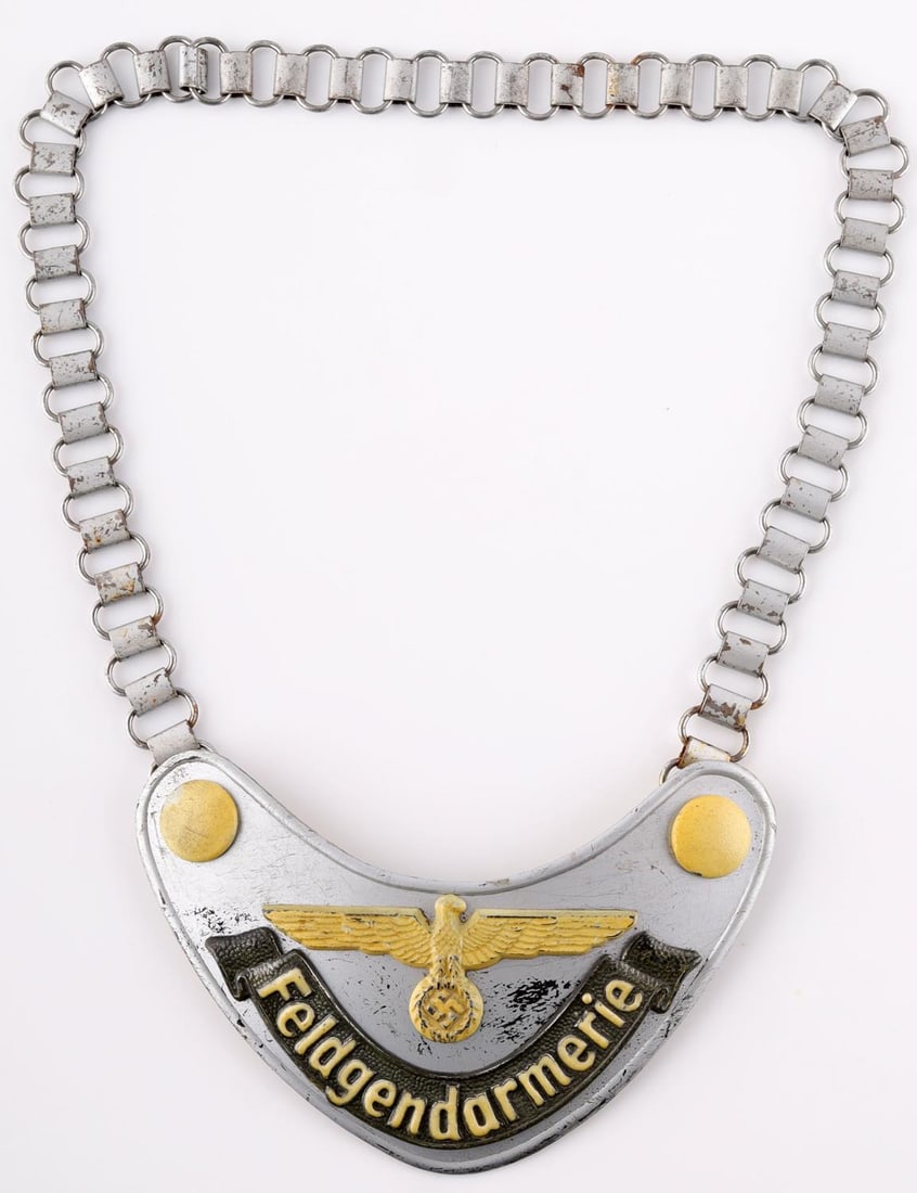 WWII GERMAN REICH HEER FIELD ZHANDARM GORGET: WWII German Reich Heer (Army) field police Feldgendarmerie gorget. Backside is stamped "A" for Assman on the clasp. Paper backing. Chain is magnetic. Fluorescent paint to the front. Chain length appro