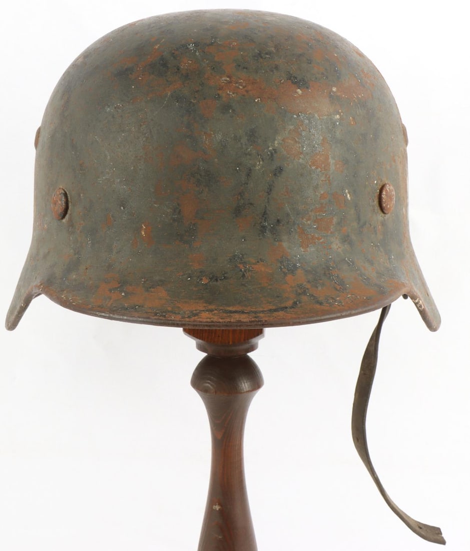 WWII GERMAN THIRD REICH M35 DOUBLE DECAL HELMET: M35 double decal helmet. Heer emblem on the left and NSDAP swastika on the right. Both decals are heavily worn. Much of the original paint is missing. 3958 is stamped on interior as well as ET64. Helm