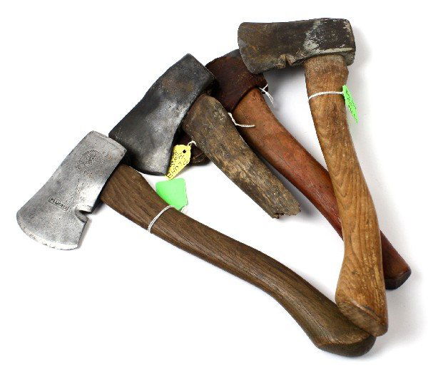 LOT OF FOUR VINTAGE PLUMB BOY SCOUT HATCHETS: Grouping of four vintage Boy Scouts of America Plumb brand hatchets. Each hatchet is stamped with Boy Scout emblem, and brand name "PLUMB" on blade. One hatchet retains original leather cover, one has