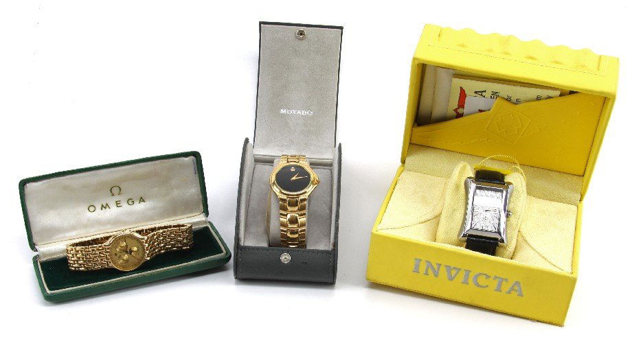 GROUP OF THREE MEN'S DESIGNER WATCHES WITH CASES: Group of three Designer Men's watches to include: an 18K Gold Electroplated Raymond Weil Chronograph watch (10 M 5402), a gold Stainless steel Sapphire crystal Movado Men's watch (88 E4 9881) and an I