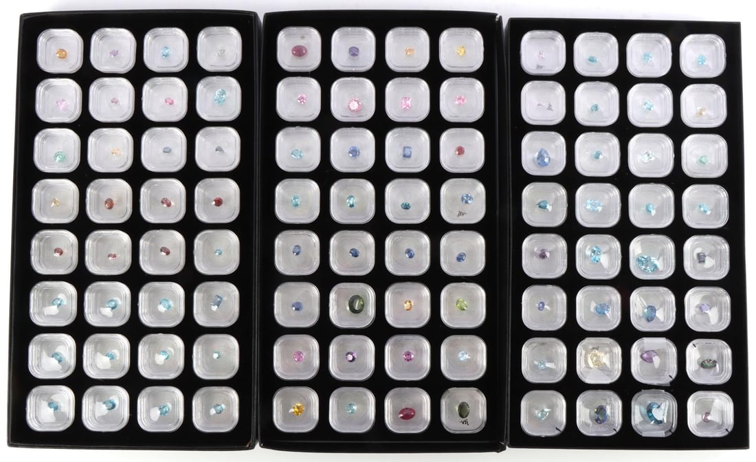 LOOSE COLORED SEMI PRECIOUS GEMSTONE LOT OF 96: Assorted colored gemstones including Topaz, Amethyst, Sapphire, Alexandrite, Tanzanite, Zircon, Ruby and others. Each individually boxed and labeled.