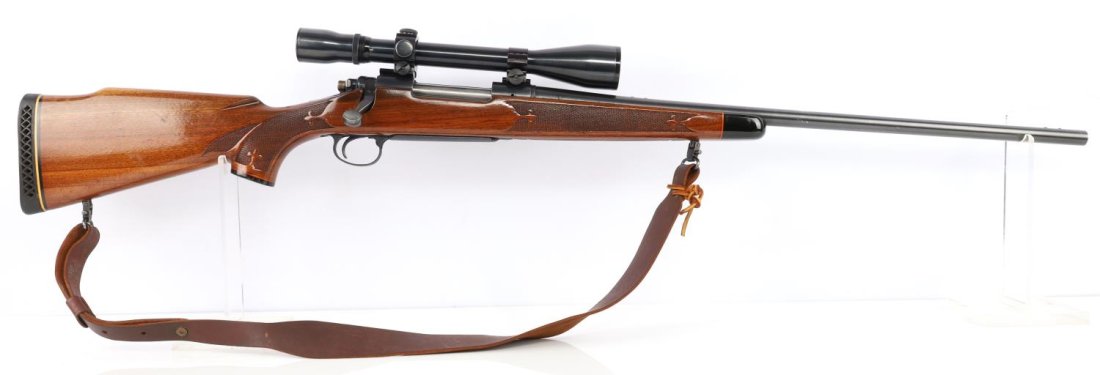REMINGTON MODEL 700 7MM REM MAG CALIBER RIFLE: 1967 Remington Model 700 7mm Rem mag. Bore is bright and clear. Mechanically very good, functions without issue. Checkered wood stock. 24 inch heavy barrel. Leather sling. Weaver V8 scope with very cl