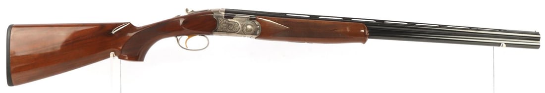 BERETTA SILVER PIGEON II 28 GA OVER UNDER SHOTGUN: Bore is bright and clear with some light fouling present. Very good finish on exterior. Blued finish with polished wood stock. 26.5 inch Steelium barrels. Ornately designed silver wrap on receiver. A 