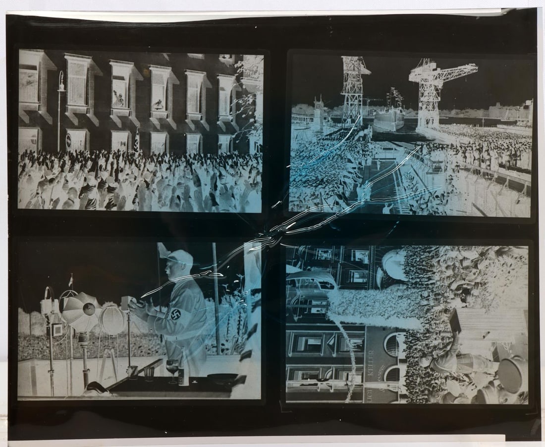 ADOLF HITLER HIENRICH HOFFMANN PHOTOGRAPH NEGATIVE: 4 different cellulose negatives of photographs taken by Heinrich Hoffman of Adolf Hitler. Three photos of Adolf Hitler addressing the German people. One photo of the launching of new Naval ship with a