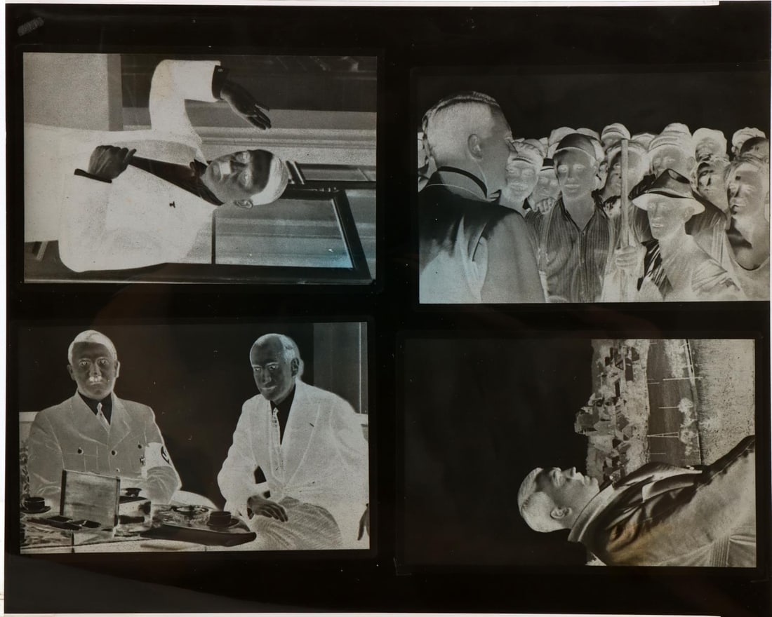 ADOLF HITLER HEINRICH HOFFMAN PHOTOGRAPH NEGATIVES: Four different photograph negatives, Hitler with Speer, speaking with Labor, and individual shots, on 8 by 10 inch cel sheet, came in original US Navy photo album, was in a 93 year veteran collection.