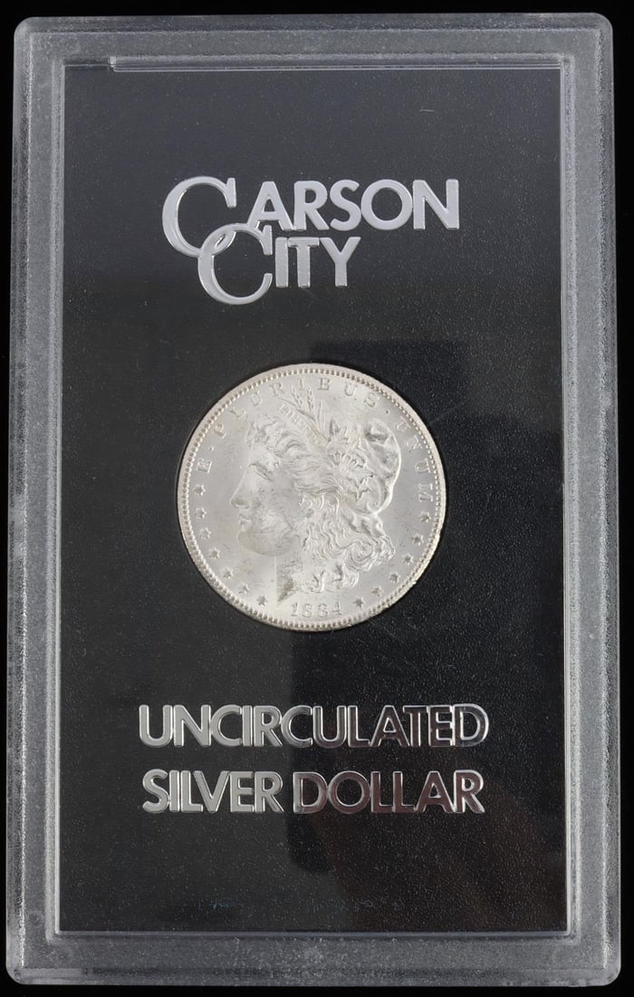 1884-CC CARSON CITY UNC SILVER DOLLAR COIN: Uncirculated 1884 Carson City silver dollar from the GSA hoard. Discovered in the Treasury vaults in the 1970s, and is in the original plastic case from the GSA sale. This lot has a reserve.