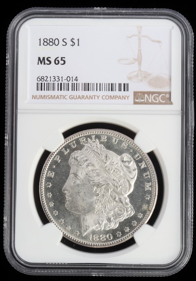 1880 S MORGAN SILVER DOLLAR NGC GRADED MS 65 COIN: Encapsulated and NGC graded Mint State 65 1880 S Morgan Dollar, San Francisco Mint. Proof like qualities with eye appeal