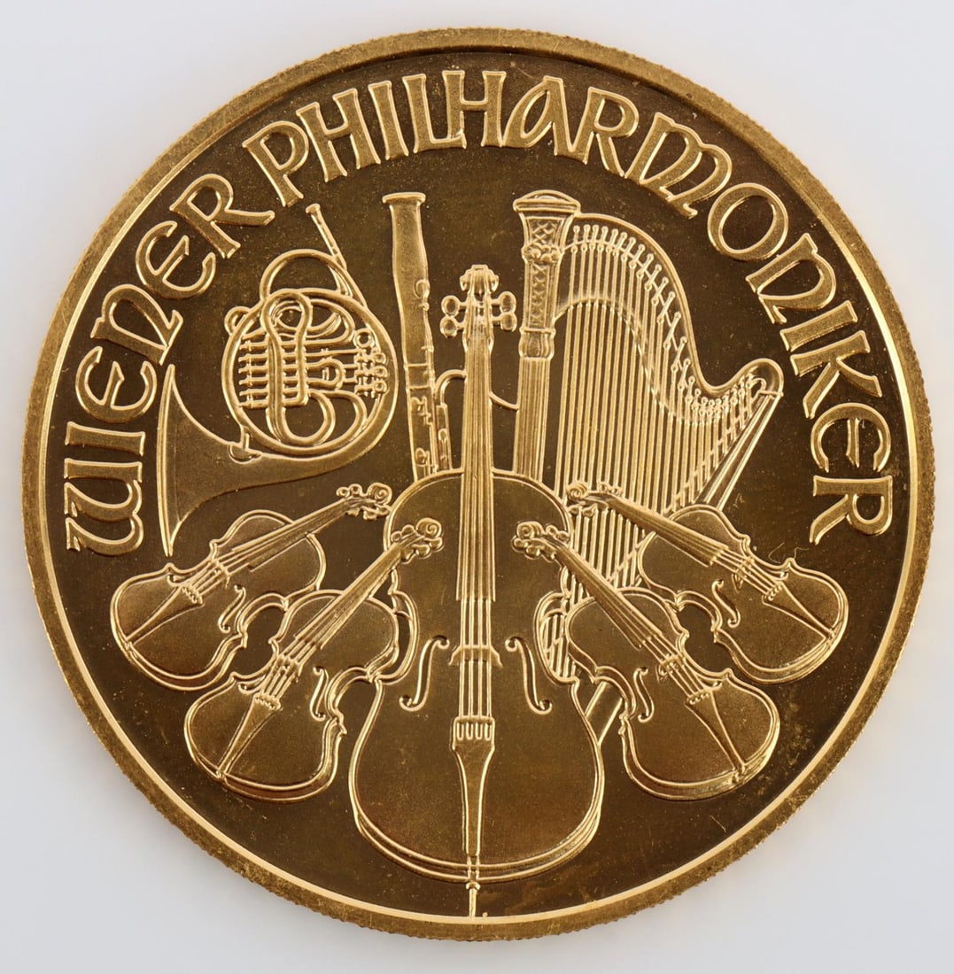 2005 1 OZ AUSTRIAN GOLD PHILHARMONIC COIN: Contains 1 oz of .9999 fine Gold. Obverse: The Great Organ of the Golden Hall in Vienna?s concert hall, the Musikverein, along with the year, weight and face value.Reverse: An array of instruments, in