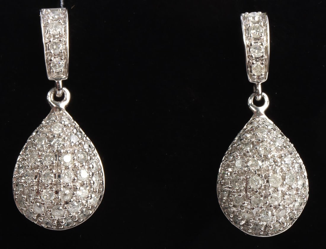 14KT WHITE GOLD AND DIAMOND CLUSTER DROP EARRINGS: Tested and stamped 14 kt white gold and diamond melee earrings. Length 1 inch (2.5cm) each. Total weight 4 grams. This lot has a reserve.