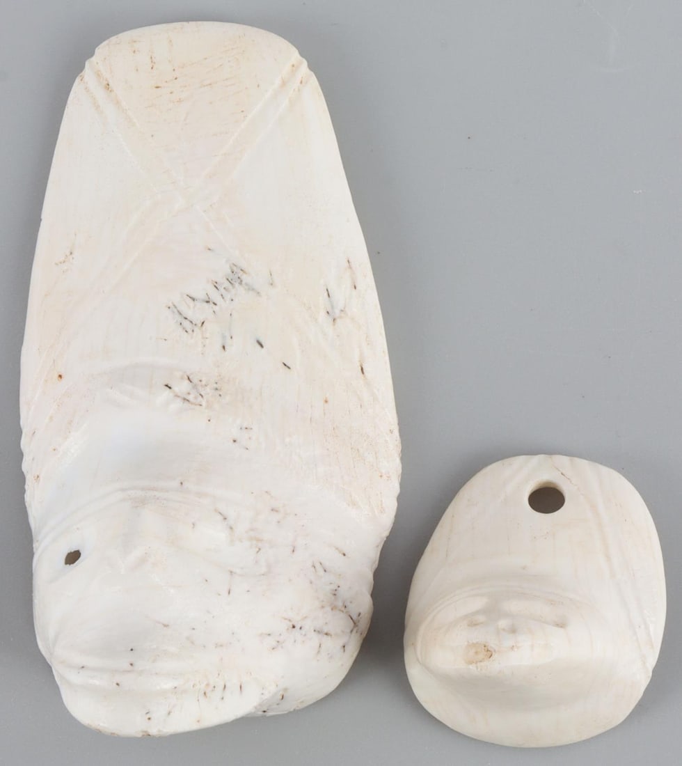 TAINO ARTIFACTS REPTILIAN PENDANT & CARVING: Taino. PreColumbian. Reptilian face pendant, possibly a snake. Made from the spire of a conch shell. Pierced at top for support. Length 1.6?. Shell. Taino Culture. c 600-1500 AD. Hispaniola. Private c