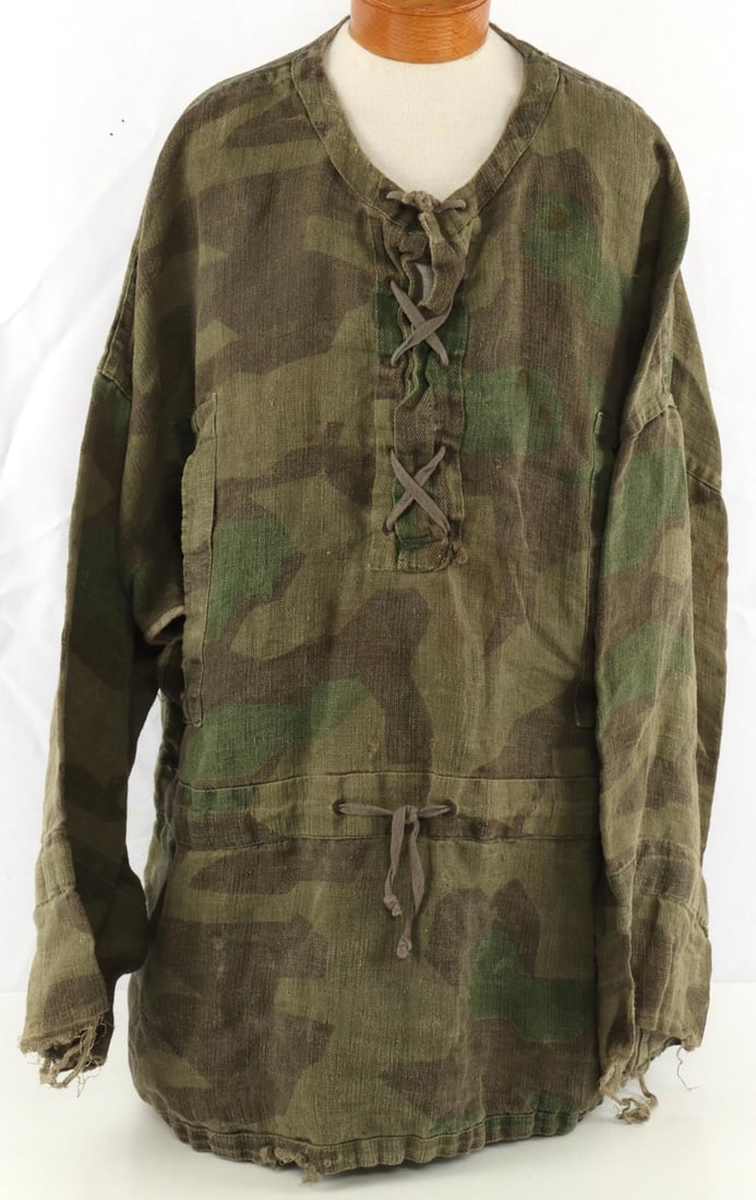 WWII GERMAN REICH WAFFEN SS CAMO FIELD SMOCK: WWII German Reich Waffen-SS Camouflage field Smock. Smock does not fluoresce. The ends of both left and right sleeves are torn a little. Smock's condition is as pictured.