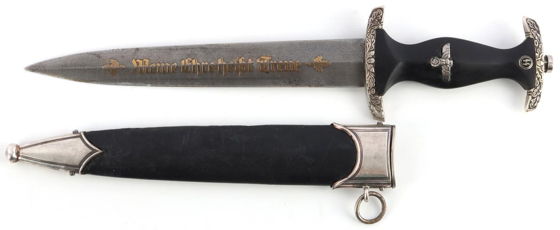 WWII GERMAN THIRD REICH SS HONOR DAGGER: Damascus blade with gold leaf in motto. Nickel crossguards feature acorns and oak leaves. Grip is ebonized with inlaid eagle and SS runes. Reverse of blade has been filed. Housed in leather bound with
