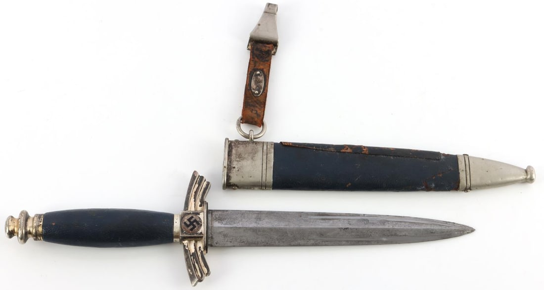 WWII GERMAN REICH NSFK FLYER DAGGER WITH SCABBARD: Steel blade with SMF make. Crossguard and pommel appear to be silvered nickel. Grip is leather bound wood. Scabbard is leather bound and has been re-patched. Measures 13 1/4 inches. This lot has a res
