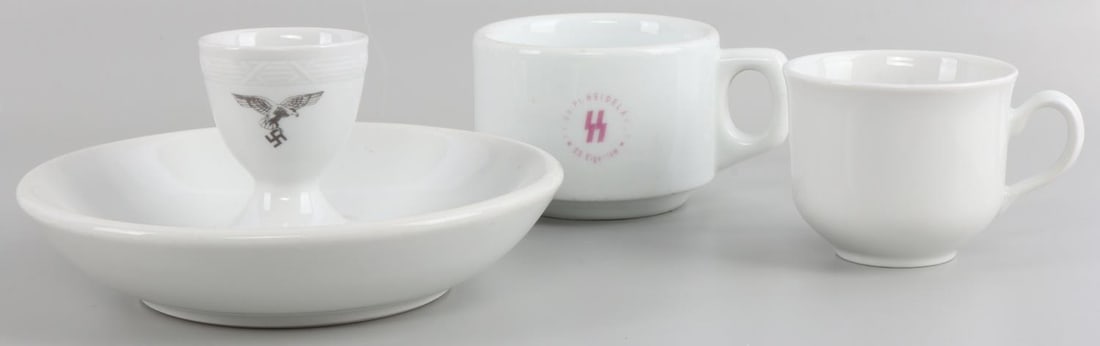 WWII GERMAN REICH SS LUFTWAFFE PORCELAIN DISHES: Lot features 2 cups, one egg holder, and one plate. Luftwaffe and SS monogrammed. They measure 2 1/2 - 6 1/2 inches. Very good condition.