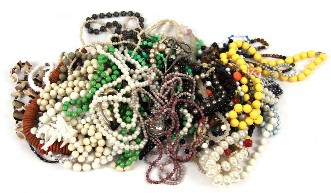 DEALERS LOT OF COSTUME NECKLACES: Dealers lot of ladies costume necklaces including vintage beads, faux pearls, shells, faux ivory, and more. Many different colors, styles, and sizes. Weight: Approximately 3 lbs. Condition: Very good