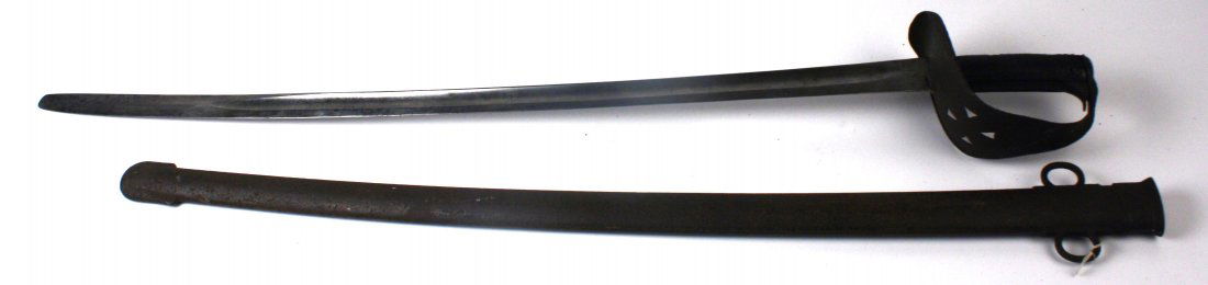 BRITISH PATTERN 1885 CAVALRY TROOPERS SABER: British Pattern 1885 Cavalry Trooper's saber. 33 1/2 inch broad fullered blade, with British inspection marks on ricasso. Basic sheet metal cup guard, with Maltese Cross pattern on front. Blade is goo