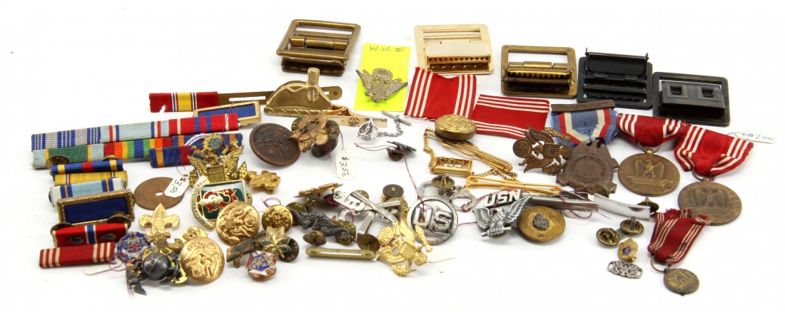 MIXED GRAB BAG STYLE LOT OF US MILITARY INSIGNIA: Mixed grab bag style lot of 20th Century US Military insignia. Items include bars, cap insignia, belt buckles, pins, medals devices, USMC globe, and more. May contain some sterling items. Huge variety