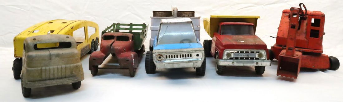 5 VINTAGE TONKA DUMP TRUCK & STRUCTO CAR TRANSPORT: Lot of five (5) vintage metal toy trucks including a Tonka Dump Truck, a Pepsi-Cola Buddy L truck, an excavator truck, a stake bed truck, and lastly a Structo Car Transport truck and trailer. All truc