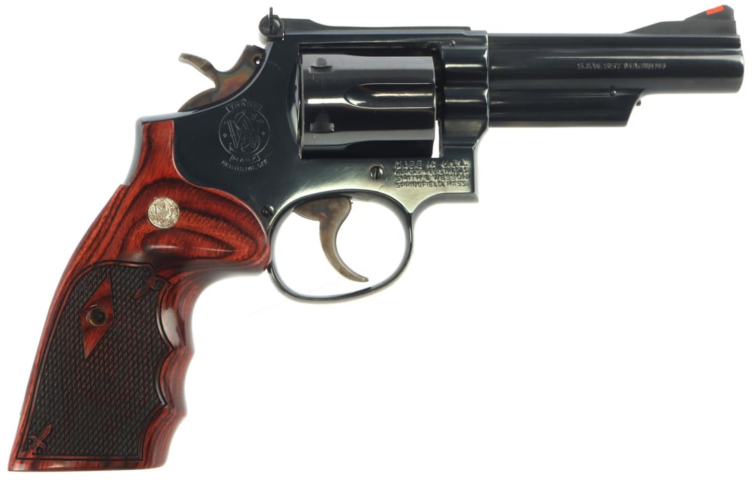 SMITH & WESSON 19-4 .357 MAGNUM REVOLVER: Smith & Wesson Model 19-4 .357 magnum caliber 6-shot revolver. Bright and clear bore. 4 inch barrel marked left "Smith & Wesson" and right "S&W .357 Magnum." Right frame marked maker. 95% blued steel