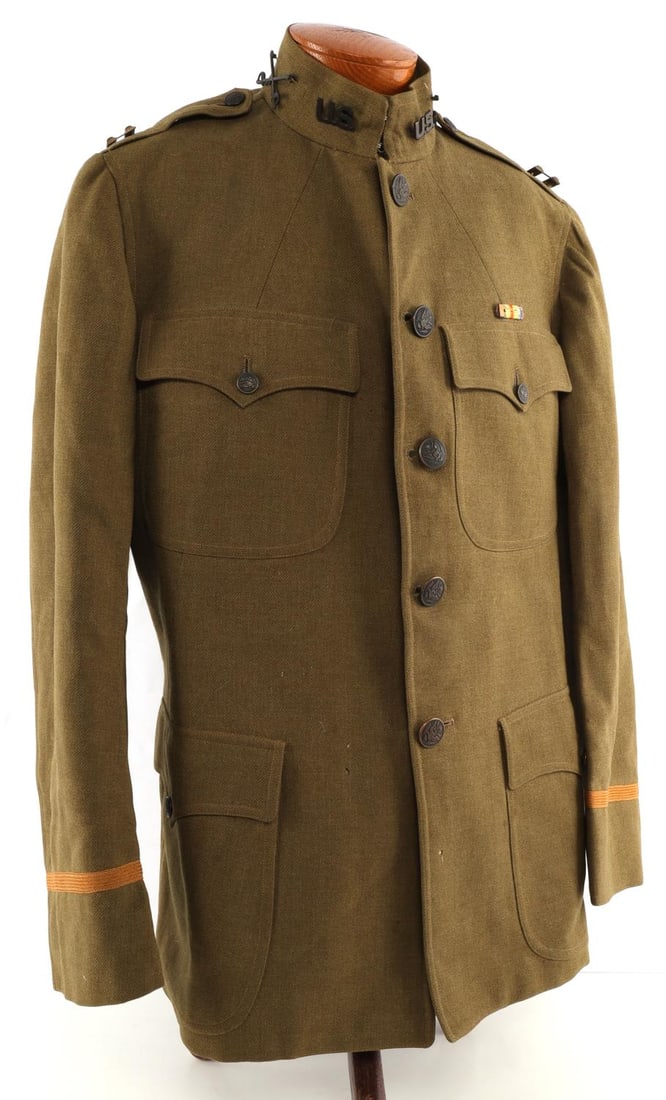 WWI US ARMY 2ND DIVISION 2ND BN CAPTAIN TUNIC: Captain tunic. Tunic features cavalry pins, captain pins, Marine patch on left arm, and WWI Victory medal ribbon. Very good condition. Large size. Minimal ripping.
