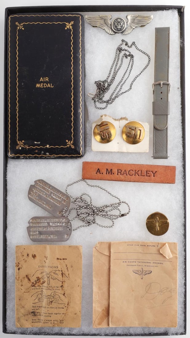 ARCHIVAL LOT FOR WWII USAAF AIR CORPS TECHNICIAN: Archival lot containing various items from a WWII United States Army Air Force, Air Corps Technician named Alphonzo Rackley II. The lot includes an Air Medal, an Aircrew Wings pin, dog tags for Rackle