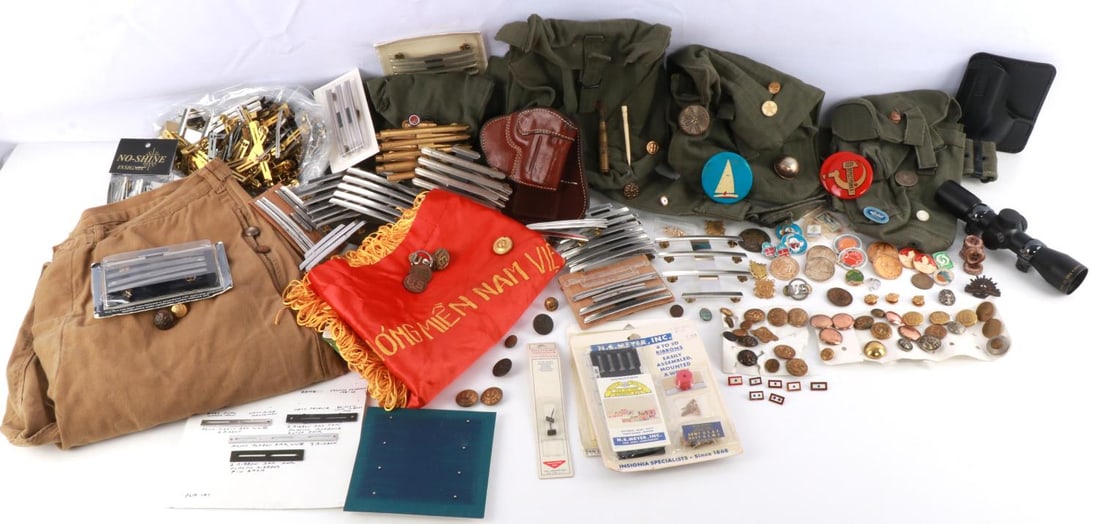 CIVIL WAR WWI WWII VIETNAM MILITARY COLLECTABLES: Nice collectables lot, to include Viet Cong flag, German Calvary Breeches size Euro 58, Heavy OD Ammo belt, medal and ribbon supplies, some in original packaging, variety of holsters, Buttons some qui