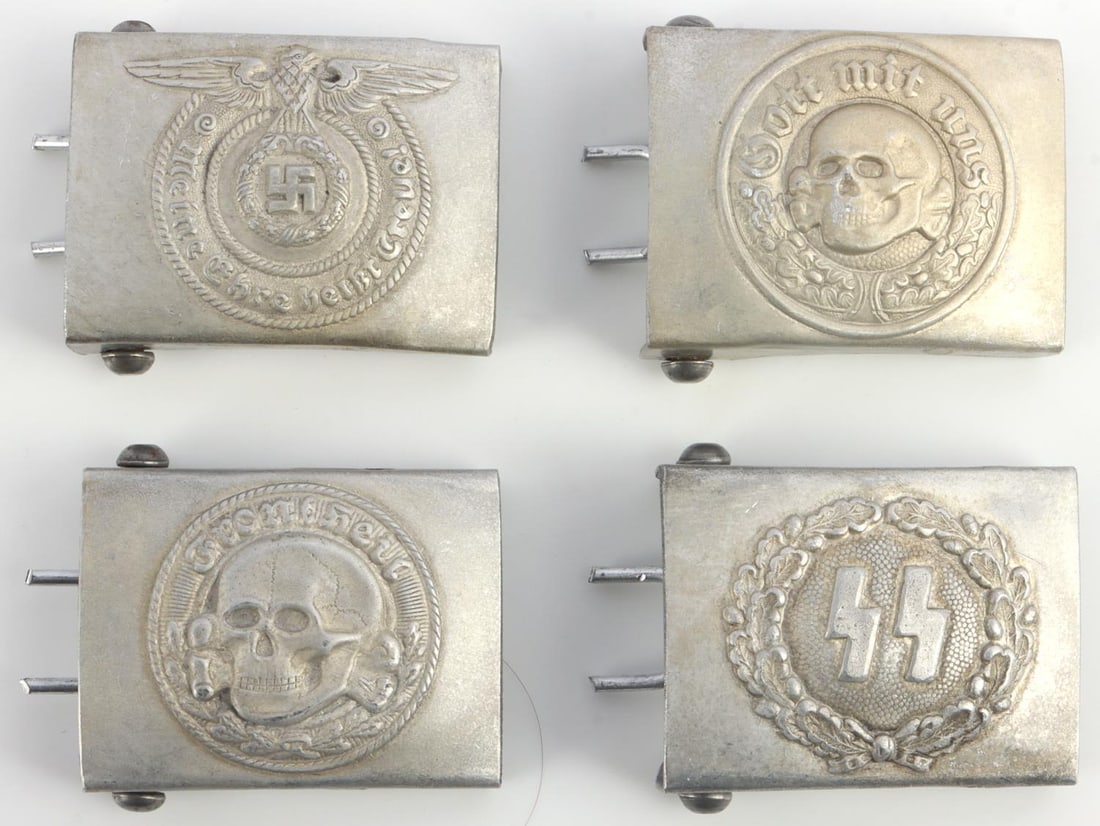 WWII GERMAN THIRD REICH SS BELT BUCKLE LOT OF 4: WWII German Third Reich SS lot of 4 belt buckles. SS enlisted, Runes and 2 patters of Totenkopf. All 4 stamped with R.Z.M. on the back of the buckles. Dimensions: 2.75 X 1.75 inches. All in very good 