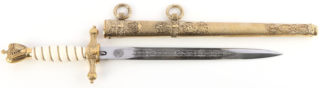 WWII GERMAN KRIEGSMARINE ADMIRALS DAGGER SCABBARD: WWII German Third Reich Kriegsmarine Admirals dagger and scabbard. A cross guard features the raised image of a fouled anchor. A steel blade is engraved with an anchor motif on both sides. Marked with