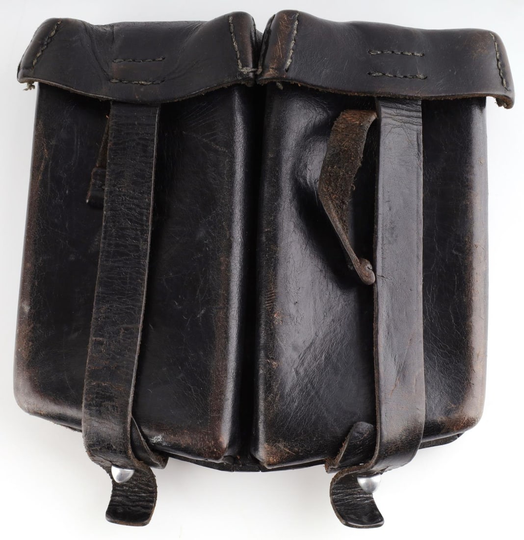 WWII GERMAN REICH WAFFEN SS LEATHER AMMO POUCH: WWII German Reich Waffen SS Leather Ammunition Pouch for MG34 or MG42 machine gun magazines. Back side of the pouch is stamped, "BGS Mego Berlin 64" and stamped with the SS runes. Leather pouch is in 