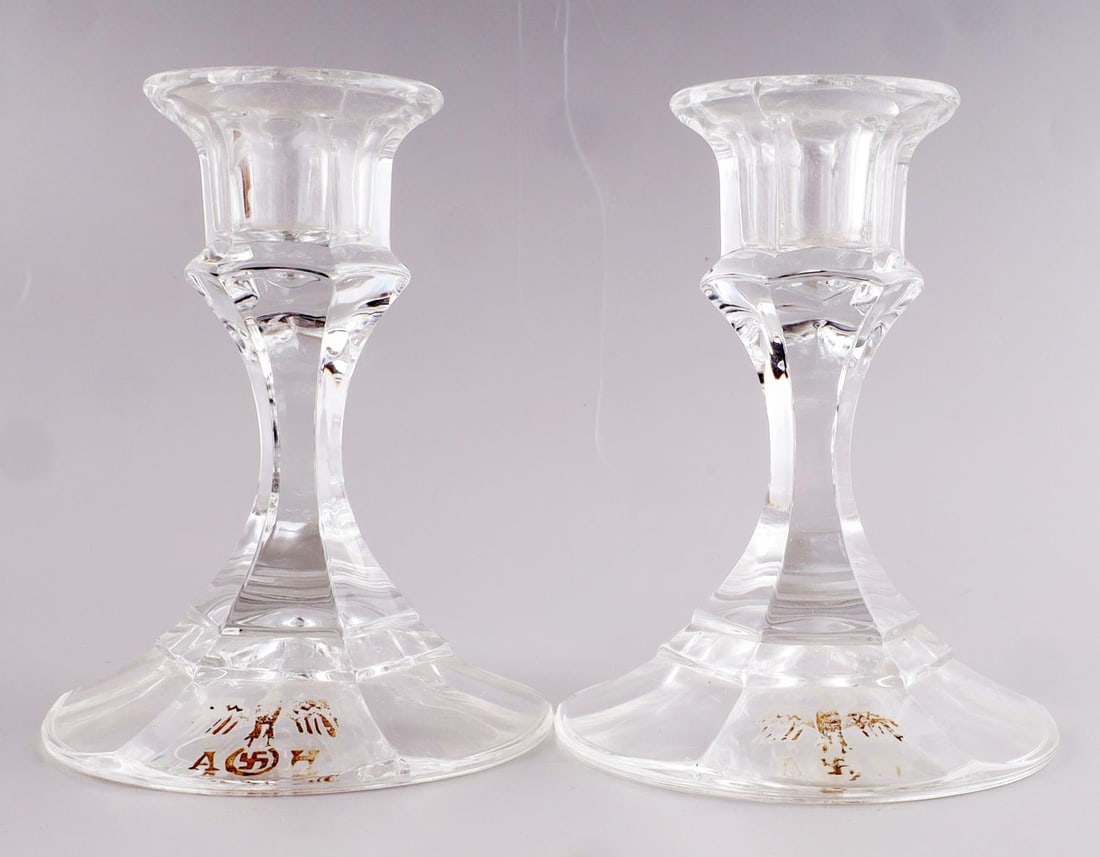 WWII GERMAN REICH ADOLF HITLER CANDLESTICK HOLDERS: Lot of two(2) WWII German Reich Adolf Hitler glass candle stick holders. Both holders feature the "AH" initials and Hitler insignia eagle. No chips or cracks in glass. Good condition. Unauthenticated,