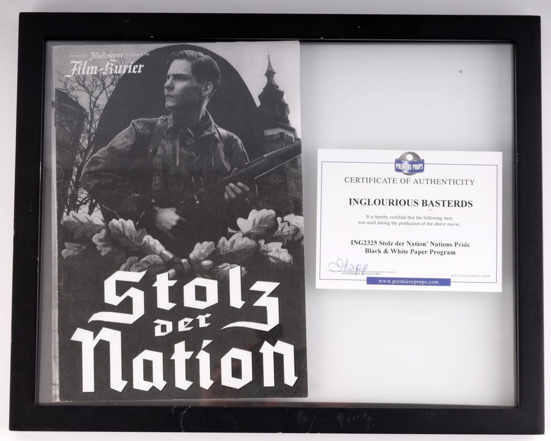 INGLORIOUS BASTERDS STOLZ DER NATION MOVIE POSTER: "Inglorious Basterds" movie poster prop for "Stolz Der Nation" depicting Daniel Bruhl. In frame measuring 14 15/16 inches wide by 11 7/8 inches tall. Includes COA from Premiere Props.