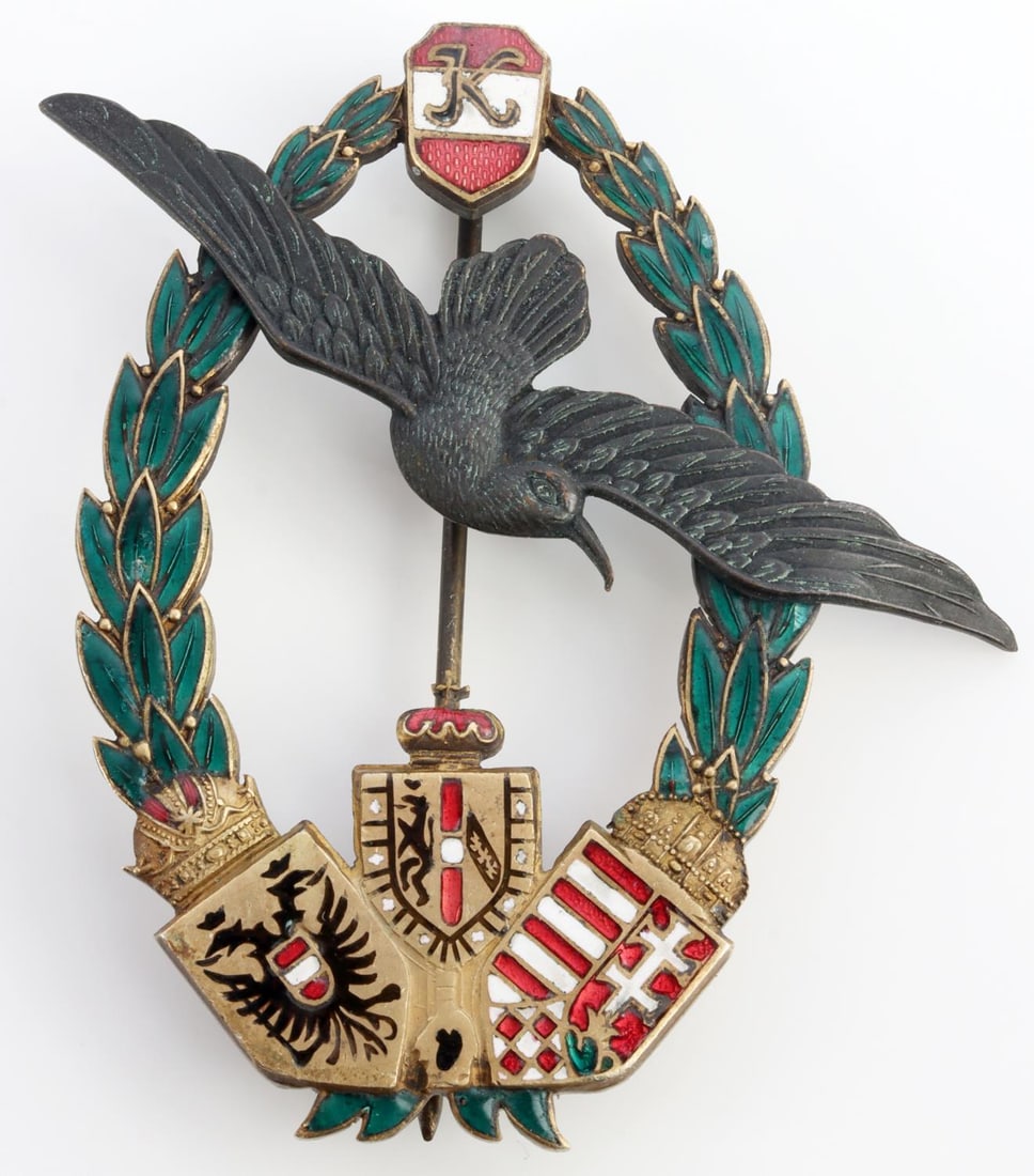 WWI IMPERIAL GERMAN AUSTRIAN NAVY PILOT'S BADGE: Standard badge with eagle in the center and oak leaf wreath. Measures 2 5/8 inches. Very good condition.