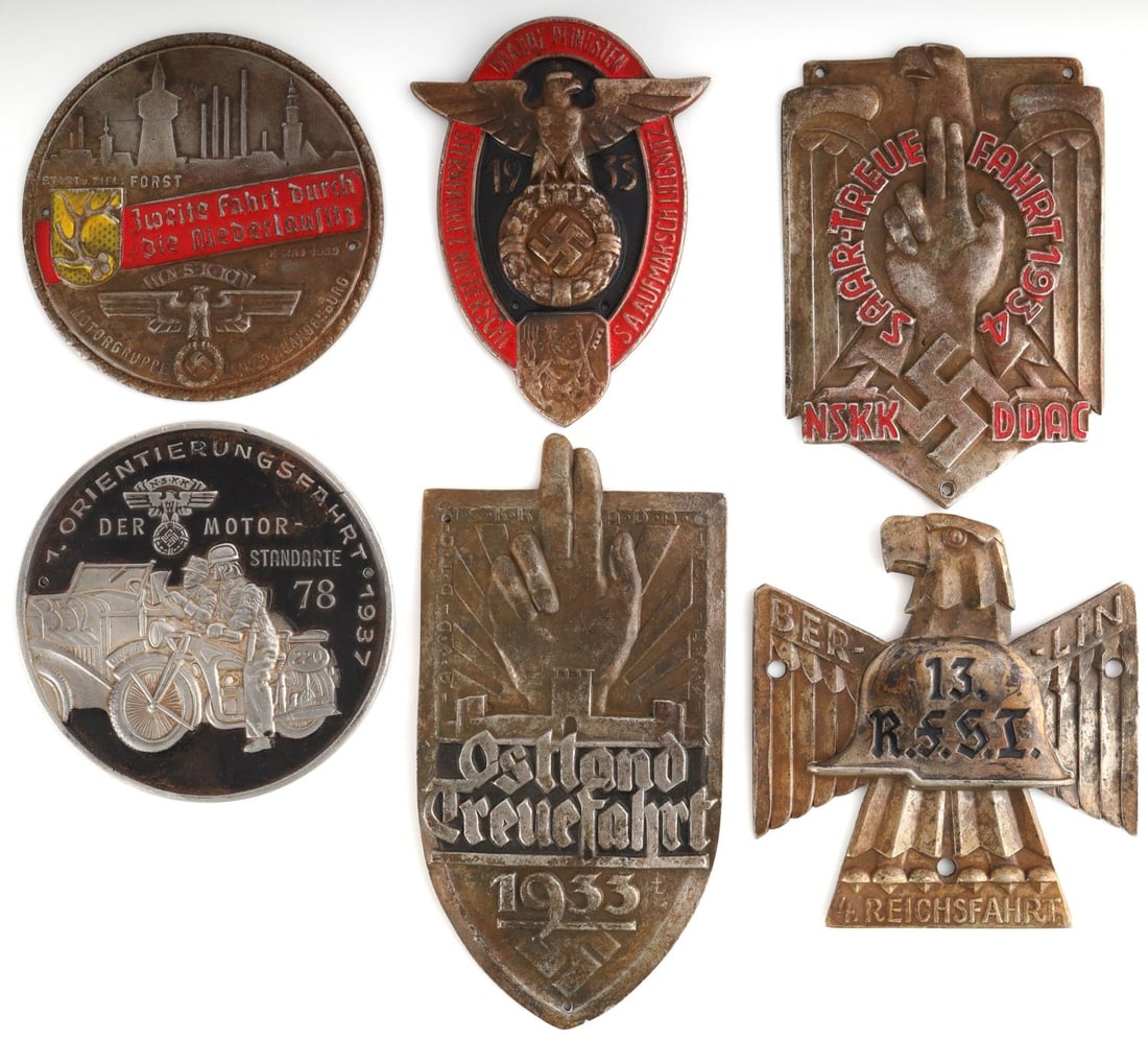 6 WWII GERMAN REICH NSKK & DDAC SLEEVE SHIELD LOT: Lot of six (6) WWII German Reich sleeve shield badges including NSKK Motorgruppe, Braune Pfingsten 1933, Ostland, DDAC, and lastly Reichsfahrt. Sizes range approx. between 3 - 4.5 inches. All in good 