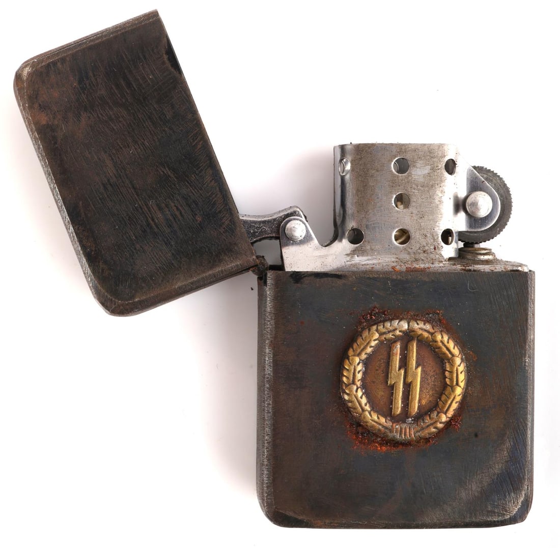WWII GERMAN REICH WAFFEN SS CIGARETTE LIGHTER RZM: WWII German Reich Waffen-SS Cigarette lighter. Features SS runes encircled by a wreath. Bottom of the lighter is marked with the Nazi proof, dated 1944, and marked "Ges Gesch RZM". Lighter is in good 