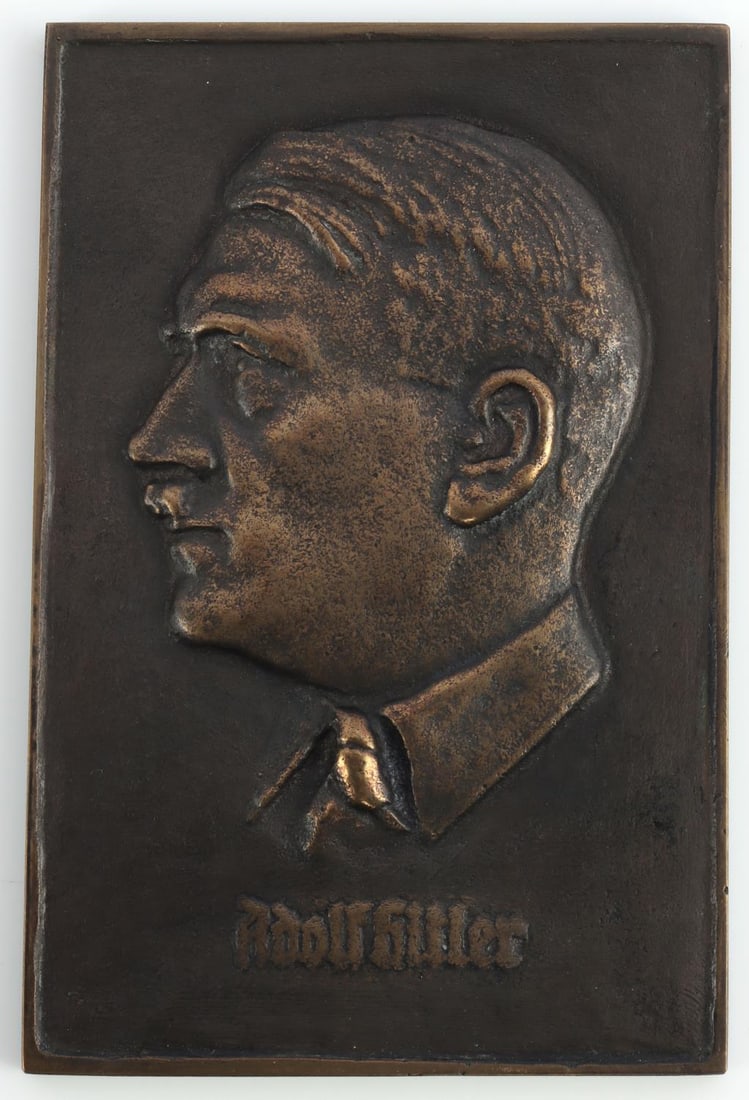 WWII GERMAN ADOLF HITLER BRONZE HONOR WALL PLAQUE: WWII German Adolf Hilter Bronze Honor wall plague. Hook on the back for mounting, crown making with "HAG" on back side. Approximate dimensions: 5.25 X 3.5 inches. Very good overall condition. Unauthen