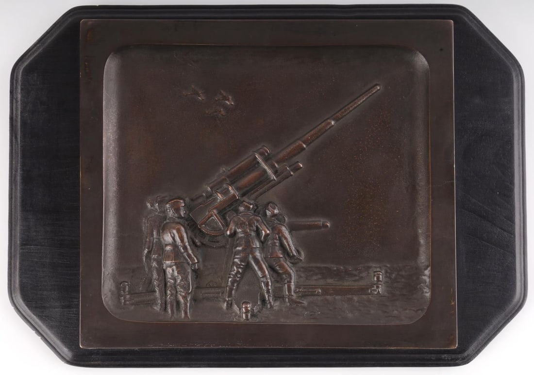 WWII GERMAN REICH LUFTWAFFE BRONZE & WOODEN PLAQUE: WWII German Reich Luftwaffe bronze and wooden wall plaque. Features a Luftwaffe Flak squadron. Wood has metal hook on reverse for hanging. Size approx. 6 1/2 inches by 9 1/2 inches. Good condition.
