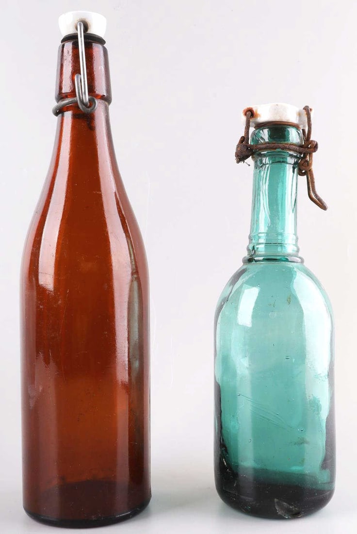 WWII GERMAN THIRD REICH SS BEER BOTTLE LOT OF 2: Lot of 2 WWII German SS beer bottles. Both ceramic tops are marked SS - REICH 1940. Both in very good condition. Unauthenticated and sold as is.