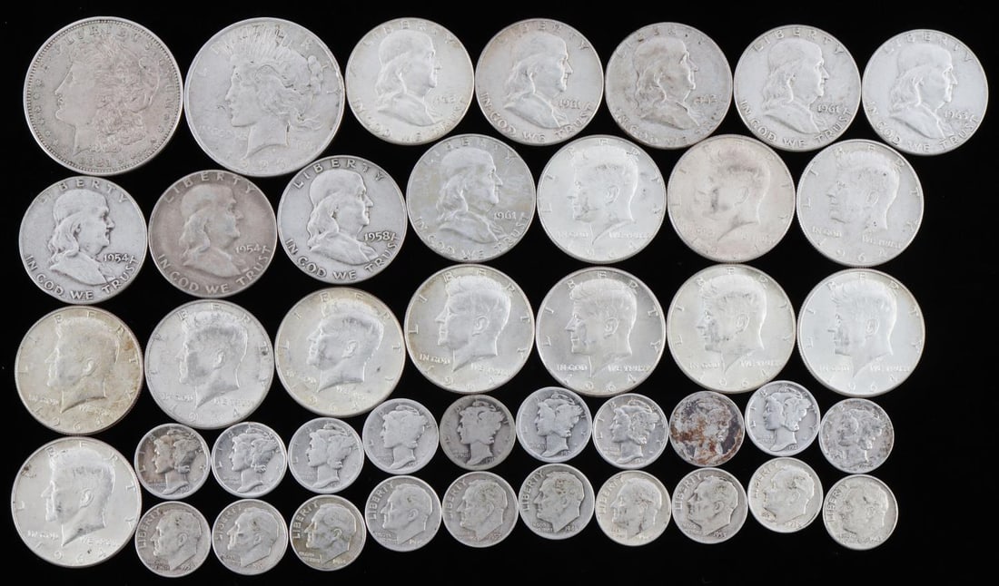 90% US CONSTITUTIONAL SILVER COIN LOT FV $14: Unsearched, mixed date and condition, pre 1964, 90% silver coinage. Total face value $14, lot includes Franklin and Kennedy half dollars, Morgan and Peace dollar and Mercury and Roosevelt dimes. This 