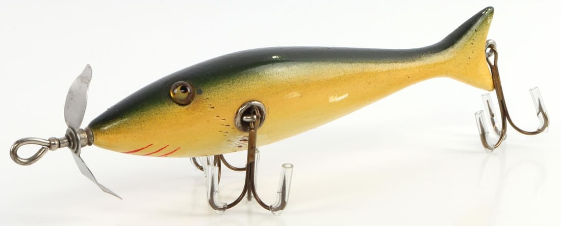 HEDDON #1300 BLACK SUCKER MINNOW FISHING LURE: Very rare. Circa 1911. Approx length tail to start of spinner mount is 5 3/4 inches. Total length 6 5/8 inches. Condition: glass eyes intact, few minor teeth marks and chips to paint but overall very 