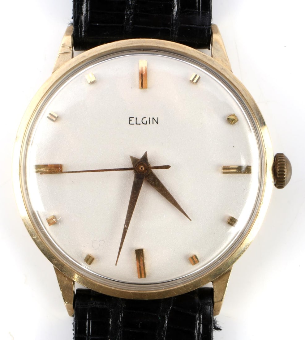 MID CENTURY ELGIN 14KT GOLD MECHANICAL WRIST WATCH: Men's Elgin wrist watch with 14kt gold 35mm case (includes the crown) with appropriate wear to reverse, clear crystal and clean cream dial with 14kt gold hands, 11/16 Lizagator genuine lizard leather