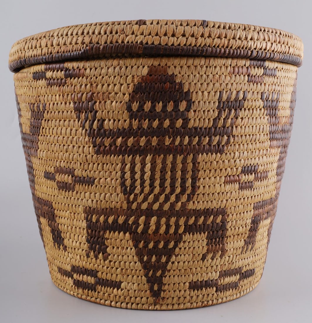 PIMA PAPAGO INDIAN POLYCHROME LIDDED BASKET: Southwestern Native American coiled zoomorphic polychrome lidded basket with age patination and light wear to the outside edge of the lid. Lid fits well with some resistance. Height 8 inches with lid,