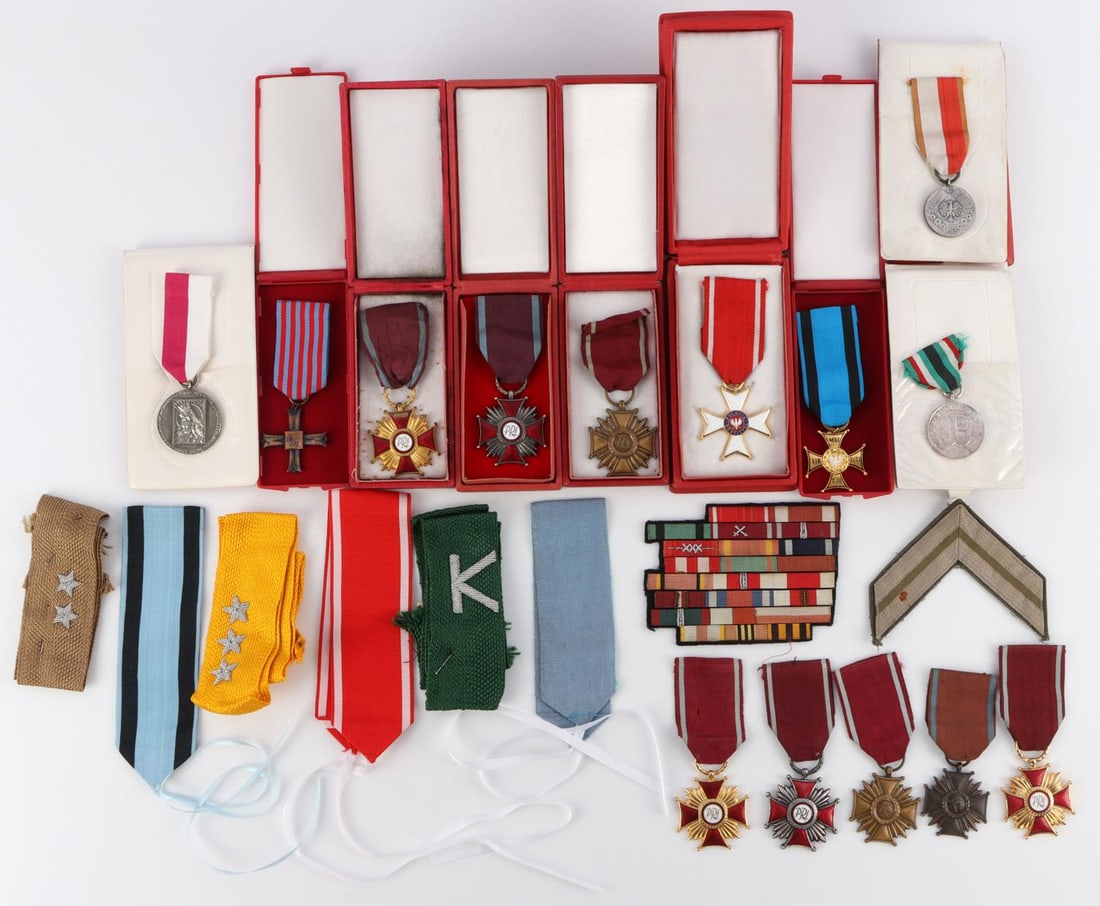 LARGE LOT OF POSTWAR POLISH CASED MILITARY MEDALS: Lot of WWII to Postwar Polish cased military medals and badges including a cased Polish Crosses of Merit(bronze, silver, and gold), cased Commemorative Monte Casino Cross, cased Order for Prisoners MI