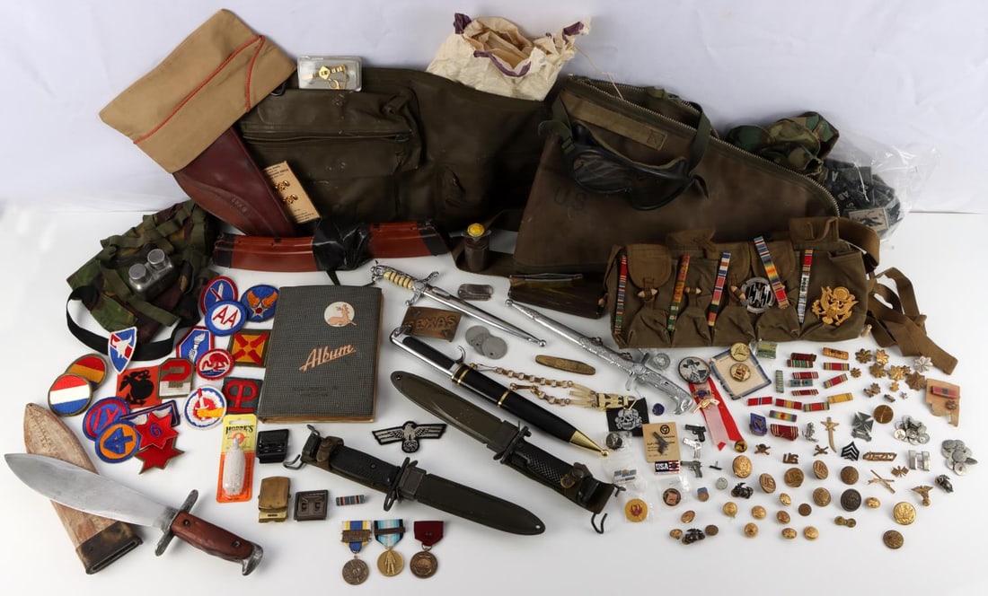 WWI WWII LARGE COLLECTION OF MILITARY ITEMS GEAR: Partial list includes, Barrel bags, Bolo Knife, U.S. Bayonets, dog tags, knives, medals, Third Reich items, M1 helmet covers, rare 1968 Vietnam in country photo album, insignia including sterling, and