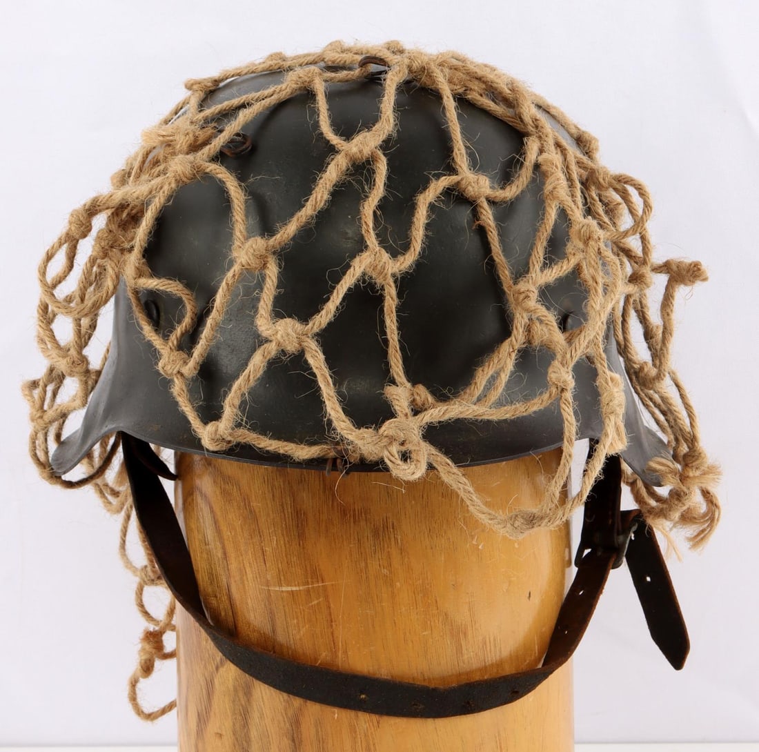 WWII GERMAN THIRD REICH M42 HELMET: Nice original helmet without decals, rear impressed 4 over 5193, no stampings over ears, with netting and hooks, good 8 finger liner, and chin strap, not dated.