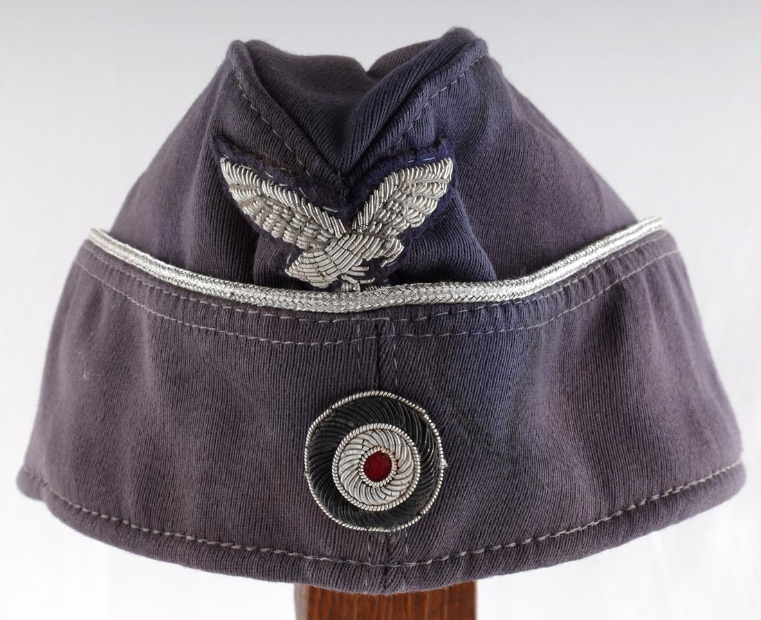 WWII GERMAN REICH LUFTWAFFE OFFICER'S SIDE CAP: WWII German Reich Luftwaffe Officer's Overseas/Side Cap. Cap features silver bullion piping, bullion eagle, and cockade insignia. Interior of the cap is marked, "Karl Turpe & Co. Mandeburg" 1944. Inte