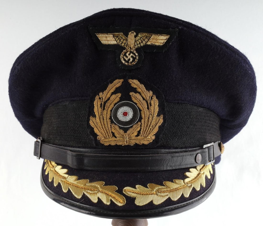 WWII GERMAN NAMED UBOAT CAPTAIN KRIEGSMARINE VISOR: Named to "Kapt. Lt. H. Wedemeyer U-365" Tailor tag for "CRIHA Christian Haug Berlin No18." Liner in good condition. Very nice bullion design on exterior with cockade and eagle. Does not fluoresce.