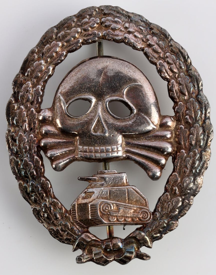 WWII GERMAN THIRD REICH CONDOR LEGION BADGE: This badge readily tests for .800 silver and the pin attachment appears to be one piece as if molded, no makers mark reverse, also reverse porosity, the obverse has age or case toning with exceptional